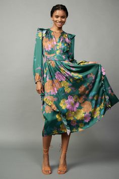 Combining a colorful floral print and feminine ruffle trim, this long-sleeve midi dress is a true stunner. It's breezy and flattering, designed with a split neckline, a clean placket, and a gathered bodice drawn in by smocking at the back waist. •Split neckline •Long sleeves •Ruffle trim •Smocked back waist •Mid-length Luxury Multicolor Casual Midi Dress, Luxury Summer Midi Dress With Vibrant Print, Luxury Multicolor Midi Dress For Fall, Mob Printed Long Dress, Floral Print Midi Dress Formal, Luxury Midi Dress With Vibrant Print For Summer, Luxury Floral Print Fall Midi Dress, Luxury Feminine Printed Dresses, Luxury Printed Midi Dress For Vacation