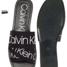 Size Us7.5 Trendy Calvin Klein Open Toe Sandals, Calvin Klein Sandals For Spring Vacation, Trendy Calvin Klein Sandals For Spring, Calvin Klein Casual Sandals For Vacation, Casual Calvin Klein Sandals For Vacation, Black Flat Sandals For Spring, Calvin Klein Chic Synthetic Sandals, Chic Calvin Klein Synthetic Sandals, Calvin Klein Open Toe Sandals With Cushioned Footbed