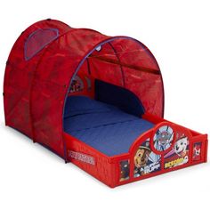 a children's bed with a red tent and blue mattress in the middle, which has paw patrol characters on it