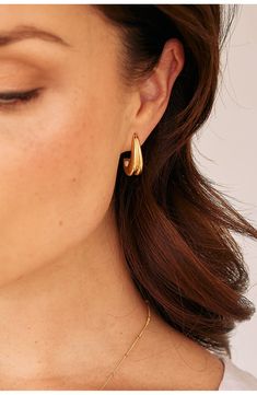 Shaped from 14-karat-gold vermeil in a bit of a bubbly silhouette, these trend-right huggie hoop earrings will fall right into your rotation. 3/4" hoop diameter; 3/8" width Post back Sterling silver/14k-gold plate Imported Modern Gold Plated Teardrop Huggie Earrings, Everyday Yellow Gold Teardrop Huggie Earrings, Everyday Teardrop Huggie Earrings With Polished Finish, Small Hoop Huggie Earrings For Everyday Elegance, Modern Huggie Jewelry For Everyday Elegance, Yellow Gold Teardrop Hoop Earrings For Everyday, Modern Everyday Elegance Huggie Jewelry, Everyday Yellow Gold Teardrop Hoop Earrings, Modern Gold Plated Hypoallergenic Huggie Earrings