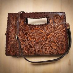 Featuring a gorgeous chiseled artisan design, this rustic  HAND TOOLED LEATHER Purse will help you bring a little VINTAGE flair to your everyday outfit. The perfect size for fitting all of your everyday essentials, this purse was actually handmade with love and care by talented artisans giving it a rustic touch that's hard to find in stores.  This purse comes CHISELED BOTH SIDES. The perfect choice as a GIFT FOR HER!! ( Birthday, Mothers day, etc.)  Measures: 🌹height: 20cm. 8  inch 🌹width : 29 Embossed Shoulder Bag With Top Handle For Everyday Use, Embossed Top Handle Shoulder Bag For Everyday Use, Brown Embossed Shoulder Bag For Everyday, Everyday Embossed Tote Satchel, Hand Tooled Rectangular Shoulder Bag For Everyday Use, Hand Tooled Rectangular Bag For Daily Use, Rectangular Hand Tooled Shoulder Bag For Everyday Use, Rectangular Hand-tooled Bags For Everyday Use, Brown Embossed Tote Shoulder Bag