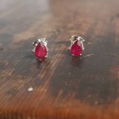 🤍TEARDROP RUBY STUDS  These teardrop ruby earrings feature stunning ruby earrings which are genuine, natural gemstones.  The faceted 6x4mm teardrop rubies are prong set in sterling silver earring studs. The classic pink ruby gems in silver settings makes for a lush and stylish pair of earrings.  The colour of these rubies is a beautiful bright pink ruby colour. The silver and red is a striking colour combination. These earrings are feminine and pretty. These rubies are pear cut, faceted, natural gemstones. They have had some glass fill treatment. Each ruby has a diameter of 4mm and a height of 6mm.  The earrings settings and posts are sterling silver. The earrings are supplied with sterling silver butterfly backs as shown in the image. 🤍 PACKAGING I take great pride in making my jeweller Pear-shaped Ruby Gemstone Earrings, Pear-shaped Ruby Earrings, Classic Pear-shaped Ruby Jewelry, Ruby Teardrop Earrings Fine Jewelry, Pear-shaped Ruby Earrings For Gift, Ruby Gemstone Briolette Earrings, Ruby Stud Earrings, Ruby Earrings Studs, Pink Ruby