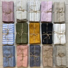 many different colored towels tied together with twine