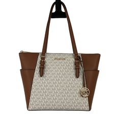 Michael Kors Cream Brown Vanilla Gold Monogram Bag Charm Zip Top Shoulder Double Handles Charlotte Large Tz Tote Bag Purse -Condition- New With Tags -Please See Photos For Any Possible Wear -Smoke Free Home -Pet Friendly Home -Size- Please See Photo For Measurements Cream Monogram Canvas Tote Shoulder Bag, Classic Cream Monogram Canvas Bag, Beige Logo Shoulder Bag For Everyday Use, Chic Cream Monogram Canvas Bag, Beige Logo Shoulder Bag For Errands, Beige Coated Canvas Shoulder Bag With Branded Hardware, Beige Double Handle Bag With Logo, Cream Monogram Canvas Bag For Everyday Use, Beige Logo Tote Shoulder Bag