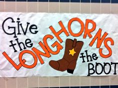 a sign that says give the longhorns the boot