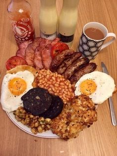 an english breakfast with eggs, sausages and beans