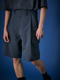 Editor's NotesThese unique Bermuda cargo shorts are designed with formal style waistband, classy relaxed silhouette with front tucks and big cargo pockets. They're tailored from cooling polyester with refreshing touch and less wrinkles. Style it with same cooling polyester fabric series - Structure hidden double taylor cooling jacket, Laid back big pocket volume shirt and Volume cropped cooling short-sleeve shirt.- Zip and double hook fastenings- Two front slash pockets- Two back welt pockets- Two side cargo pockets- Front tucks- Signature metal trim at belt loop- Relaxed fit- Cooling polyester from Takisada NagoyaMeasurements (in.) S / M / L - Total Length: 24.4 in. / 25.2 in. / 26.0 in. - Waist: 30.7 in. / 32.7 in. / 34.6 in.- Hip: 49.2 in. / 51.2 in. / 53.1 in.- Thigh: 30.7 in. / 31.9 i Custom Streetwear, Bermuda Cargo, Front Tuck, Big Pocket, Metal Trim, Formal Style, Nice Shorts, Welt Pockets, Short Pants