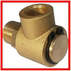 a brass colored valve with a red border around it