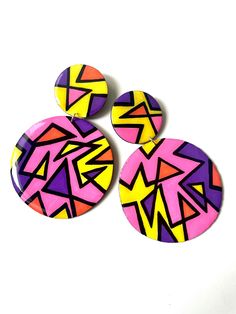 Get into these funky, oversized, sunset-toned earrings! They are sure to add a bold, vibrant statement to any outfit. Each pair is extremely lightweight and easy to wear.  All earrings are made to order. Please allow up to 5 days for this process. As with almost anything handmade, note that there may be slight variations, but the overall design will be the same. Bold Geometric Designed Earrings, Bold Geometric Earrings With Bold Design, Bold Geometric Earrings, Bold Drop Earrings With Bold Design, Summer Retro Drop Earrings, Retro Yellow Earrings For Party, Yellow Retro Party Earrings, Retro Yellow Party Earrings, Funky Yellow Handmade Earrings