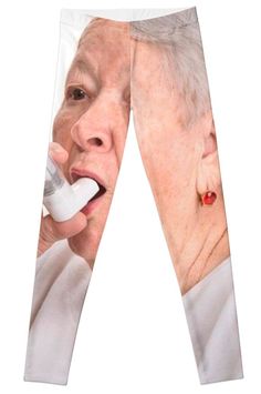 an elderly woman talking on the phone with her hand in her mouth and holding a remote control to her ear