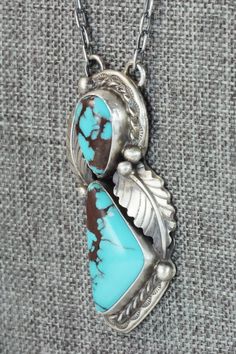 This turquoise and sterling silver necklace was strung by Navajo silversmith Betta Lee. The back of the necklace is signed B. Lee and stamped sterling.Necklace: 19"Length: 2"Width: 7/8"Free shipping on all orders! We ship with USPS and always include tracking. All orders ship within a day of payment.Returns are accepted up to 30 days after you receive your order. Just send us a message. Our shop offers cash back or store credit. The item must be returned in new condition. Southwestern Engraved Turquoise Necklace, Engraved Southwestern Turquoise Necklace, Southwestern Style Engraved Turquoise Necklaces, Western Style Collectible Turquoise Sterling Silver Necklace, Southwestern Sterling Silver Turquoise Necklace, Southwestern Untreated Turquoise Collectible Necklace, Southwestern Turquoise Sterling Silver Collectible Necklace, Southwestern Sterling Silver Turquoise Necklace Collectible, Southwestern Stamped 925 Necklaces For Collectors