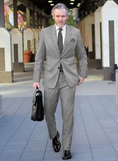 In the suiting world, versatility is a hard thing to find, but our Vintage Plain Gray Tweed Suit offers a sharp sartorial figure one can have. Crafted from wool, Whether you're attending an exclusive gala, a high-stakes boardroom meeting, or a grand wedding celebration, this suit ensures you command attention and admiration.  Look Includes    Vintage Plain Gray Tweed Fabric  Two Button Jacket Style  Notch Lapel  Horn Royal Black Buttons  Single Vent   Three Cuff Buttons  Two Welted Back Pockets Business Tweed Jacket With Herringbone Pattern, Classic Tweed Suit For Business Casual, Classic Tweed Business Casual Suit, Semi-formal Herringbone Tweed Jacket, Business Casual Wool Tweed Jacket With Pressed Crease, Business Casual Wool Tweed Jacket, Formal Tweed Jacket With Welt Pockets, Tailored Semi-formal Tweed Jacket With Herringbone Pattern, Tailored Tweed Jacket With Herringbone Pattern For Semi-formal