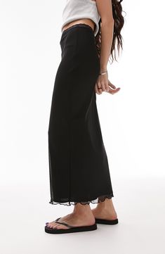 A gauzy mesh overlay lends eye-catching interest to this maxi skirt trimmed with lovely lace. 36" center front length (size TS-6) Lined 97% polyester, 3% elastane Machine wash, line dry Made in Turkey Ankle-length Lined Maxi Skirt, Ankle-length Solid Lined Maxi Skirt, Solid Ankle-length Lined Maxi Skirt, Solid Color Ankle-length Lined Maxi Skirt, Relaxed Ankle-length Maxi Skirt With Elastic Waistband, Full Length Bottoms With Lace Trim For Spring, Sheer Flowy Skirt Bottoms, Chic Fitted Maxi Skirt With Lace Trim, Ankle-length Lined Relaxed Skirt