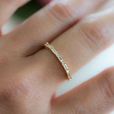 Sweet, simple, and dainty ring. Perfect for a minimalist look, or for stacking.  ☆ Details ☆ * Made of 925 Sterling Silver * Available in 14k Gold Plating, Rhodium or Rose Gold * Ring Height: 1.5mm * We use a THICK, DURABLE 14k GOLD plating - for a piece that will last you years to come!  * VERY HIGH QUALITY  * Available in sizes 4-10 * Feature baguette stones with alternating cz stones  * Made out of the Highest Grade of Cubic Zirconia Stone for an authentic look Ring Sizer- https://www.etsy.com/listing/1240904225/ring-sizer-reusable-ring-sizer-plastic?click_key=b5e074cfb419bcfddc2d9f2ce4b2f5376e4b8de0%3A1240904225&click_sum=ac940e75&ga_search_query=ring%2Bsizer&ref=shop_items_search_2&pro=1 ✈️READY TO SHIP! Ships out same day, for quick delivery. Domestic Orders arrive in 2-3 days. Int'l Gold Minimalist Ring, Simple Diamond Ring, Baguette Diamond Band, Baguette Wedding Band, Zierlicher Ring, Simple Diamonds, Unique Wedding Bands, Gold Ring Stack, Cz Ring