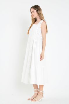 Introducing our stunning Eyelet Maxi Dress, perfect for any occasion. Expertly crafted from soft eyelet fabric, this dress is designed to ensure both style and comfort. Its graceful maxi length elongates your silhouette while the relaxed fit allows for all-day wear. The sleeveless design adds a touch of elegance and functionality. Ideal for a day out with friends or dressed up for a special event, this dress is a must-have in your wardrobe. Shop now and elevate your style with our Eyelet Maxi Dr White Cotton Maxi Dress With Broderie Anglaise, Casual Eyelet Dress For Brunch, White Eyelet Dress For Brunch, White Casual Eyelet Dress, Cotton Broderie Anglaise Maxi Dress, Chic Eyelet Midi Dress, White Sleeveless Maxi Dress With Broderie Anglaise, Feminine Eyelet Midi Dress, White Broderie Anglaise Sleeveless Maxi Dress