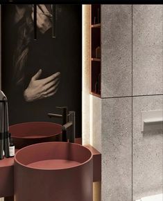 a bathroom with two sinks and a large painting on the wall