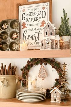 the shelves in this kitchen are decorated with christmas decorations and other holiday decorating items