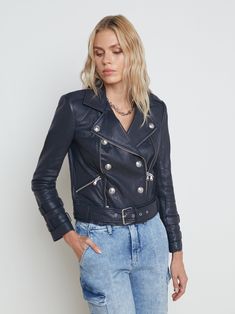 A biker-style blue leather jacket elevated by embossed silvertone buttons. Edgy-authentic details include an attached leather belt, zipper pockets and zipper trim, sleeve straps, and chunky belt with buckle. Fully lined. 100% Lambskin. *Slim fit through the arms, size up if you plan to layer* | L'AGENCE Billie Belted Leather Jacket In Midnight Long Sleeve Biker Jacket With Belt Loops, Edgy Leather Belted Biker Jacket, Fall Moto Biker Jacket With Belt Loops, Edgy Leather Biker Jacket With Belt Loops, Fall Biker Leather Jacket With Belt Loops, Biker Style Belted Leather Jacket, Belted Biker Leather Jacket, Belted Moto Leather Jacket, Fall Leather Biker Jacket With Belt Loops