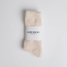 Cozy up with these super soft and ultra-luxe heathered socks. The perfect way to pamper yourself and your loved ones any time of the year. Cozy Soft Socks As Stocking Stuffers, Cozy Soft Socks For Loungewear, Cozy Soft Socks With A Cozy Fit, Cozy Socks With Soft Texture And Snug Fit, Cozy Super Soft Snug Socks, Trendy Soft Socks For Stocking Stuffers, Cozy Soft Knit Socks For Loungewear, Soft Cozy Fit Socks For Loungewear, Cozy Soft Knit Loungewear Socks