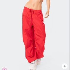 Size Is Xs/S Parachute Pants Drawstring Waistband Drawstring Ankles Cargo Pockets Nylon Model Wears Size Xs/S Model Height Is 5'9 Item Care: Wash With Similar Color Red High Waist Parachute Pants For Streetwear, Red Wide Leg Parachute Pants For Streetwear, Red Drawstring Pants For Streetwear, Red Drawstring Bottoms For Streetwear, Red Bottoms For Streetwear In Spring, Red Bottoms For Spring Streetwear, Trendy Red Sweatpants For Streetwear, Trendy Red Pants With Elastic Waistband, Red Athleisure Bottoms With Elastic Waistband