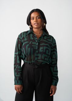 Style#: 5024/P5024 Jazz up your work fit with the Zoela Women's African Print Sheer Blouse in the Black Malachite Geometric print—an African twist to a classic sheer button-up blouse that is sure to add flavor to your wardrobe. Features: Self-lined Buttons at sleeve cuff Pointed collar 100% Polyester​ Sheer, lightweight fabric Designed in the USA, imported Care Instructions: Machine wash cold on gentle cycle with non-chlorine detergent. Hang to dry. Do not bleach. Iron on low. Models: Size: XS H