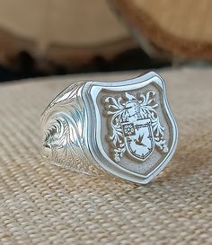 You can ask us all questions. * Logo area: Shield * Logo area width is 16*17mm. *There are special embroideries on the side arms of the ring. *I can make our rings in 10K, 14K, 18K and 22K gold. *The ring is 925 Sterling Silver. *The ring has my Brand and 925K stamp on it. * Extra discount is provided for 3 or more product orders. *Before the rings are prepared, a design will be sent to you for your approval. After the product is prepared, a photo of the finished product will be sent to you and will be shipped after you approve it. *All our products are guaranteed. *Rings are free on the side arms. (Clan) * Any personalization you want to print on the ring is free. *If permanent gold plating is desired, MICRON PLATING can be applied. It is plated with 0.5 grams of pure gold. *If you want t Vintage Antique Silver Signet Ring Gift, Antique Engraved Signet Ring In Silver, Antique Engraved Silver Signet Ring, Vintage Engraved Antique Silver Signet Ring, Antique Engraved Silver Ring, Vintage Engraved Ring For Collectible, Vintage Personalized Engraved Ring For Collectors, Classic Coat Of Arms Jewelry For Collectors, Classic Coat Of Arms Collectible Jewelry