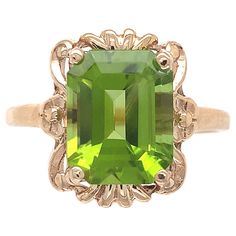 10K yellow gold ring featuring an emerald cut peridot weighing 3.73 carats. The vibrant lime green peridot measures about 10mm x 8mm. The ring fits a size 6.75 finger, weighs 1.79dwt. dates from the 1940-50's. Green Peridot Hallmarked Rings, Victorian Peridot Ring, Yellow Gold Polished Peridot Jewelry, Lime Green Peridot Rings Fine Jewelry, Luxury Peridot Three-stone Rings, Peridot Ring, Green Peridot, Ring Fit, Emerald Cut