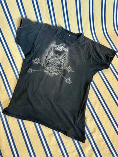 Perfectly worn-in Harley Davidson tee from the 1970s. Single stitch with eagle and skull motif. Possibly a bootleg piece, as the graphic is slightly off-center. I have looked and have been unable to find another of this design online. Sizing Tag is illegible but fits like a men's medium. Shown here on a 5'3" size XS model. Measurements 20" chest* | 21" waist* | 25" length Condition Good vintage condition. Has some sun fading and there are a few small holes on the front of the shirt (pictured), but these only add to its allure. Vintage Short Sleeve T-shirt With Skull Print, Vintage Skull Print Tops For Streetwear, Vintage Cotton Tops With Skull Print, Harley Davidson Vintage Tee, Harley Davidson Baby, Harley Davidson Tee, Harley Davidson T Shirts, Charlottesville Va, Fire Fits