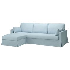 a light blue couch with pillows on it's back and the seat folded down