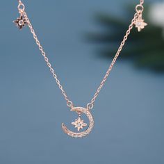 Description & Details The moon, sun, and stars became the representations of gods and goddesses throughout the years as ways to explain their presence and permanence. Solid 925 sterling silver, cubic zirconia Hypoallergenic, gold plating 14 mm charm 16-18 inch chain, adjustable Celestial Rose Gold Jewelry With Star Charm, Rose Gold Celestial Jewelry With Star Charm, Celestial Rose Gold Necklace With Moon Phase, Rose Gold Celestial Necklace With Moon Phase, Celestial Rose Gold Moon Phase Necklace, Celestial Sterling Silver Charm Necklaces With Clavicle Chain, Celestial Moon Charm Necklace In Cubic Zirconia, Celestial Cubic Zirconia Necklace With Moon Charm, Celestial Rose Gold Necklace With Moon Charm