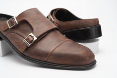 Introducing our Pull-up leather Handmade double monk strap backless mule for men, crafted to perfection and designed to elevate your style effortlessly.  These Cap toe Mule are Semi formal and dressy compared to plain-toe.. The added layer at the toe enhances the visual appeal of the shoe, making it a popular choice for Semi business attire, Semiformal occasions, and Semi professional settings.  Versatile Usage: Perfect for both formal and casual occasions, our double monk strap mule elevates your fashion sense effortlessly. Premium Materials: Crafted from premium Full grain cow aniline leather for durability and a luxury look. Breathable Lining: Goat leather lining ensures comfort and freshness all day long. The upper of our mules is made from Cow Pull up leather. It is a type of leather Luxury Plain Toe Business Slip-ons, Hand Made Shoes, Double Monk Strap, Buckle Loafers, Brown Marble, Monk Strap Shoes, Hand Painted Shoes, Slip On Mules, Goat Leather