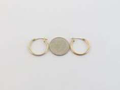 "Offering here is a pair of fabulous 14k yellow gold hoop earrings!! Purity : 14k yellow gold, Tested and stamped Measurements : 5/8\" in diameter or 17 mm wide by 1.5 mm thick. Closure: Hinged post and omega catch. Weight: 0.6 gram Complementary Gift Box These earrings are about the same size as a dime. Images may be enlarges to show details.Please pay attention to the photos and read description before the purchase. I ask you earnestly to make sure about measurements such as size , thickness, Oval Yellow Gold Hoop Earrings Stamped 14k, Oval 14k Stamped Yellow Gold Hoop Earrings, Yellow Gold 14k Huggie Hoop Earrings, 14k Yellow Gold Huggie Hoop Earrings, Small Hoop Earrings In Stamped 14k Gold, Small Hoop 14k Gold Earrings Stamped 14k, 14k Stamped Yellow Gold Hoop Earrings, Stamped 14k Yellow Gold Hoop Earrings, 14k Stamped Yellow Gold Round Hoop Earrings