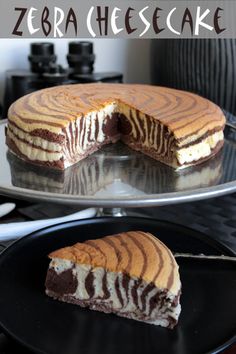 a cake that has been cut in half and is on a plate with another piece missing