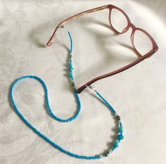 Beaded Glasses Chain - Sky Blue Handmade with beautiful sky blue seed beads, some sparkly beads and a few little silver beads. Are you tired of walking all over the house or garden looking for your glasses? with a pretty glasses chain you'll always know where your glasses are and you'll be adding a touch of bling to your look. Measures 66cm in length   FREE SHIPPING WITHIN AUSTRALIA Follow me on Instagram: https://www.instagram.com/mollyand.frankie/ Made in Byron Bay Blue Glasses Chains With Colorful Beads For Beach, Blue Beaded Glasses Chain For Beach, Blue Glasses Chains For Beach Summer, Blue Glasses Chains For Summer Beach, Blue Glasses Chains For Beach In Summer, Blue Beaded Chain Glasses Chains With Round Beads, Blue Beaded Glasses Chains, Blue Glasses Chain With Colorful Beads As Gift, Blue Glasses Chains With Round Beaded Chain