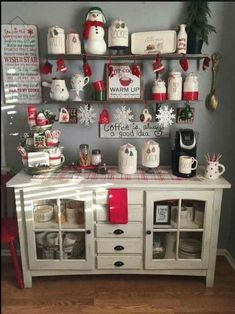 a white table topped with lots of christmas decorations