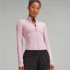 Lululemon Define Cropped Jacket * Nulu Size 6 Nwt Color : Rose Blush Whether You're Up For Adventure Or Ready For Downtime, This Shortened Version Of Our Fan-Favourite Define Jacket Has A Feel-Good Fit That Can Do It All. Designed For Casual Slim Fit, Waist Length Skims Your Body Not Too Short, Not Too Long, Just Right Around The Waistband Product Features Secure Front Pockets Thumbholes And Cuffins Keep Sleeves Down And Chills Out Back Vent Strategically Placed To Provide Airflow Locker Loop Fo Lululemon Cropped Define Jacket, Lulu Define Jacket, Lululemon Tote Bag, Lululemon Define, Define Jacket, Lululemon Define Jacket, Lululemon Jacket, Rose Blush, Blush Roses