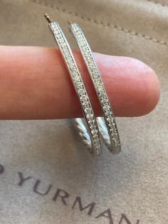 100% Authentic Previously Used Condition: very good Specifications David Yurman Diamond Hoop Earrings Estimated Retail $1775 Metal : High Polish 925 Sterling Silver Diamonds: Pave Setting round brilliant diamonds estimated .40-.45ct total Ornament: 38mm Width near 2.5mm Signature: Back of the Hoops Hallmark: 925 Post : 585 ( 14k Gold Post ) Collateral: Pouch Designer Platinum Jewelry In Diamond White, Designer Platinum Jewelry With Brilliant Cut, Luxury White Gold Hoop Earrings For Formal Occasions, Luxury Platinum Jewelry With Channel Set, Designer Jewelry With Diamond Accents For Everyday Luxury, Luxury Platinum Hoop Earrings For Wedding, Luxury Platinum Channel Set Jewelry, Luxury Silver Channel Set Jewelry, Luxury Diamond White Hoop Earrings With Channel Set