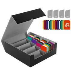 an open black box with compartments and dividers for pens, pencils, and other office supplies