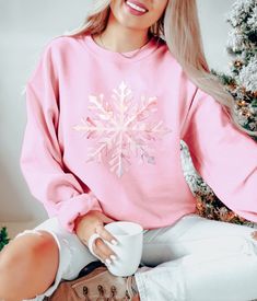 Snowflake Sweatshirt, Holiday sweater, Matching Christmas Sweater, Family Christmas gift, Snow flake design sweater, Cozy Christmas Gift A sturdy and warm sweatshirt bound to keep you warm in the colder months. A pre-shrunk, classic fit sweater that's made with air-jet spun yarn for a soft feel and reduced pilling. * 50% cotton, 50% polyester * Pre-shrunk * Classic fit * 1x1 athletic rib knit collar with spandex * Air-jet spun yarn with a soft feel and reduced pilling * Double-needle stitched co Snowflake Sweatshirt, Matching Christmas Sweaters, Vintage Christmas Shirt, Family Holiday Gifts, Snowflake Embroidery, Simple Sweatshirt, Snowflake Sweater, Bookclub Gifts, Boho Sun