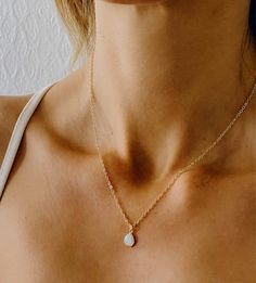 Our Orit necklace elegant opal teardrop pendant makes this everyday necklace the perfect addition to any stack. Who looking for something more dainty and elegant.  ----------------------------------- FEATURES ⟡ Opal pendant (16k gold plated over brass) ⟡ All necklace findings & chain are gold filled to ensure the highest quality piece  ⟡ 100% nickel and lead free. ⟡ Pendant size : 6 X 11mm ----------------------------------- JEWELRY PACKAGING : ⟡ All of our jewelry comes packaged in our Gift pre Simple Gold Pendant Necklace, Gold Everyday Necklace, Everyday Necklace Gold, Breastmilk Pendant, Dainty Opal Necklace, Gold Bridesmaid Necklace, Delicate Layered Necklace, Simple Gold Necklace, Breastmilk Jewelry