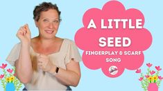 a woman is holding her fingers up in front of a sign that says a little seed