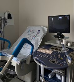 a hospital room with a monitor and medical equipment