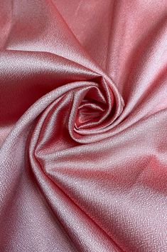 a close up view of a pink fabric