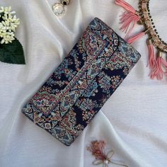 This Boho wallet is meticulously handcrafted using brocade fabric adorned with patterns reminiscent of traditional Turkish motifs, complemented by accents of vegan leather. Its allure and elegance are a testament to the classic Turkish design inspirations that grace both its front and back panels. Designed and meticulously crafted in Turkey, these wallets pay homage to the country's rich cultural heritage. Turkey is globally acclaimed for its vibrant history, stunning landscapes, and cultural di Elegant Multicolor Wallets For Everyday Use, Elegant Multicolor Wallet For Daily Use, Elegant Multicolor Wallets For Daily Use, Elegant Multicolor Wallets With Card Slots, Elegant Multicolor Clutch Wallet, Vintage Multicolor Wallet For Daily Use, Multicolor Clutch Coin Purse With Card Slots, Multicolor Pouch Clutch With Card Slots, Vintage Multicolor Clutch For Daily Use