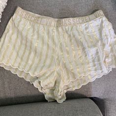 Victoria’s Secret Pajama Shorts! Super Cute White Ruffle Pajama Shorts With Shiny Gold Logo And Stripes All Over! Never Worn In Like New Condition! White Shorts With Elastic Waistband For Sleepover, White Summer Pajama Shorts For Loungewear, White Shorts For Summer Sleepover, White Summer Pajama Shorts For Lounging, White Short Bottoms For Sleepover, White Shorts For Sleepover, White Short-length Bottoms For Sleepovers, White Short Length Sleepwear For Sleepover, Victoria's Secret Summer Sleepwear Bottoms