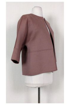 Sophisticated rose pink Michael Kors open cropped jacket. Crafted with a crew neck, three-quarter sleeves and tonal stitching throughout. The perfect layering piece for the season, you will love its soft-to-the-touch fabric blend. Size 8 Open front Rounded neckline Cropped sleeves Unlined 55% virgin wool, 40% angora, 5% cashgora Made in Italy Fall 2014 Bust 40" Waist 40" Shoulder to hem 23.5"