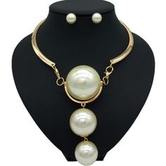 Description Here is a stylish Gold Pearl Necklace which not only modifies your look but also adds value to your personality. The Pearl has a soft glamour which makes it look very beautiful. There are two colors on this necklace available which are Gold and Silver. One can wear these necklaces for any occasion or ceremony. Features Material:Metal, Copper Alloy Pattern:Geometric Color:Gold /silver Pendant material:Pearl What Includes 1*Necklace 1 Pair ofEarrings Measurement Earrings Height: 0.90 i Chic Alloy Necklaces For Party, Elegant Dangle Alloy Necklaces, Chic Alloy Dangle Jewelry, Chic Dangle Alloy Jewelry, Elegant Alloy Pendant Necklace, Elegant Pendant Necklace In Alloy, White Alloy Necklace For Party, Elegant White Alloy Necklaces, White Alloy Necklaces For Party