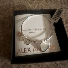 Alex And Ani Silver Bangle Bracelet With Heart Charm. Brand New. Never Worn. Still In Box. Bracelet Is Adjustable Metal Heart Bangle Bracelet For Anniversary, Metal Heart Bangle For Anniversary, Adjustable Heart Bangle Bracelet For Gift, Heart-shaped Charm Bracelet For Personalized Gift, Heart Charm Bracelet For Personalized Gift, Personalized Heart Charm Bracelet Gift, Elegant Adjustable Nickel-free Heart Bracelet, Personalized Silver Heart Bracelet, Adjustable Heart Charm Bangle Bracelet