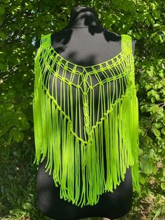 Handmade Macrame Top - a festival essential perfect for parties, beach parties, and birthday celebrations. This neon boho-style top adds a touch of charm to your party wear, ensuring you stand out with style at every special occasion. Information: * Material: polyester cord. * Color: neon - ready to ship.  * Size: s-m  * Handmade by myself in Lithuania, Europe. * Size s-m in neon is ready to ship. For other sizes or other colors - please contact me by messages here on Etsy.  Care recommendations Summer Party Crop Top With Fringe, Hippie Beach Tops With Tassels, Green Crochet Beachwear Top For Spring, Beachwear Triangle Top For Parties, Green Crochet Top For Beachwear In Spring, Green Crochet Top For Spring Beachwear, Bohemian Crochet Top With Tassels For Vacation, Hippie Summer Tops With Tassels, Bohemian Crochet Top For Beach Party In Spring