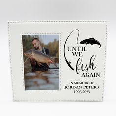 a man holding a fish in front of a white frame with the words until we fish again